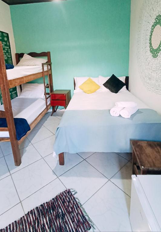Postel nebo postele na pokoji v ubytování Pousada Lira Praieira Paraty