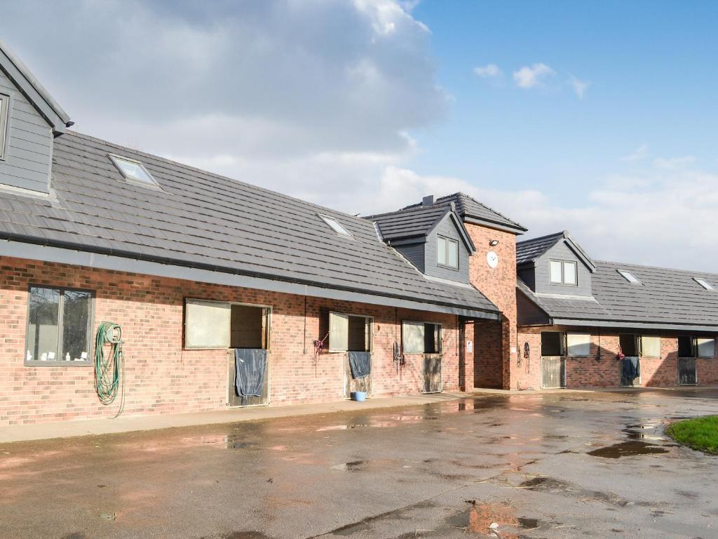 a row of brick buildings with roofs at Hanoverian Suite - Uk41830 in Tickton
