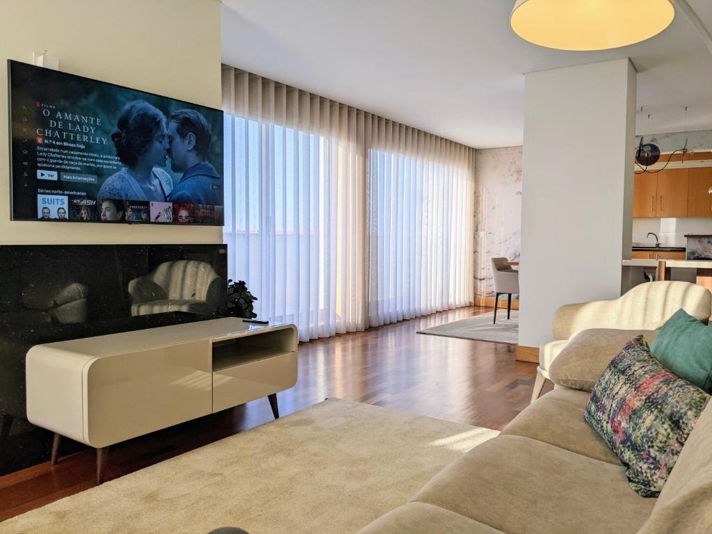 A television and/or entertainment centre at Duplex by the Beach