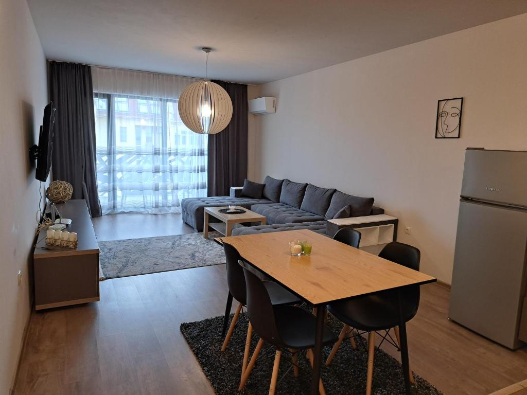 a living room with a couch and a table at City Apartments 2 in Pazardzhik