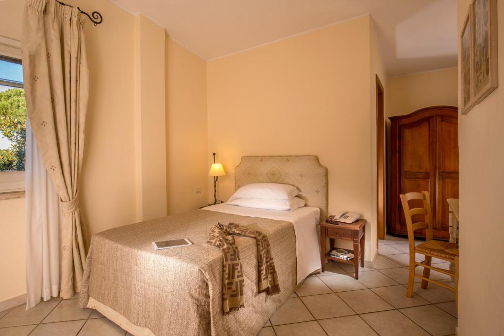 Postel nebo postele na pokoji v ubytování Hotel Selva Candida