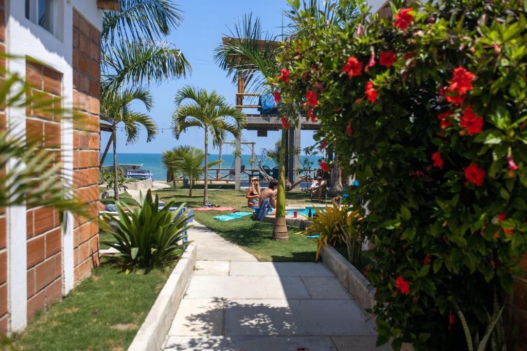 a view of the beach from a building with flowers at Free Spirit Ecuador, Puerto Engabao in Engabao