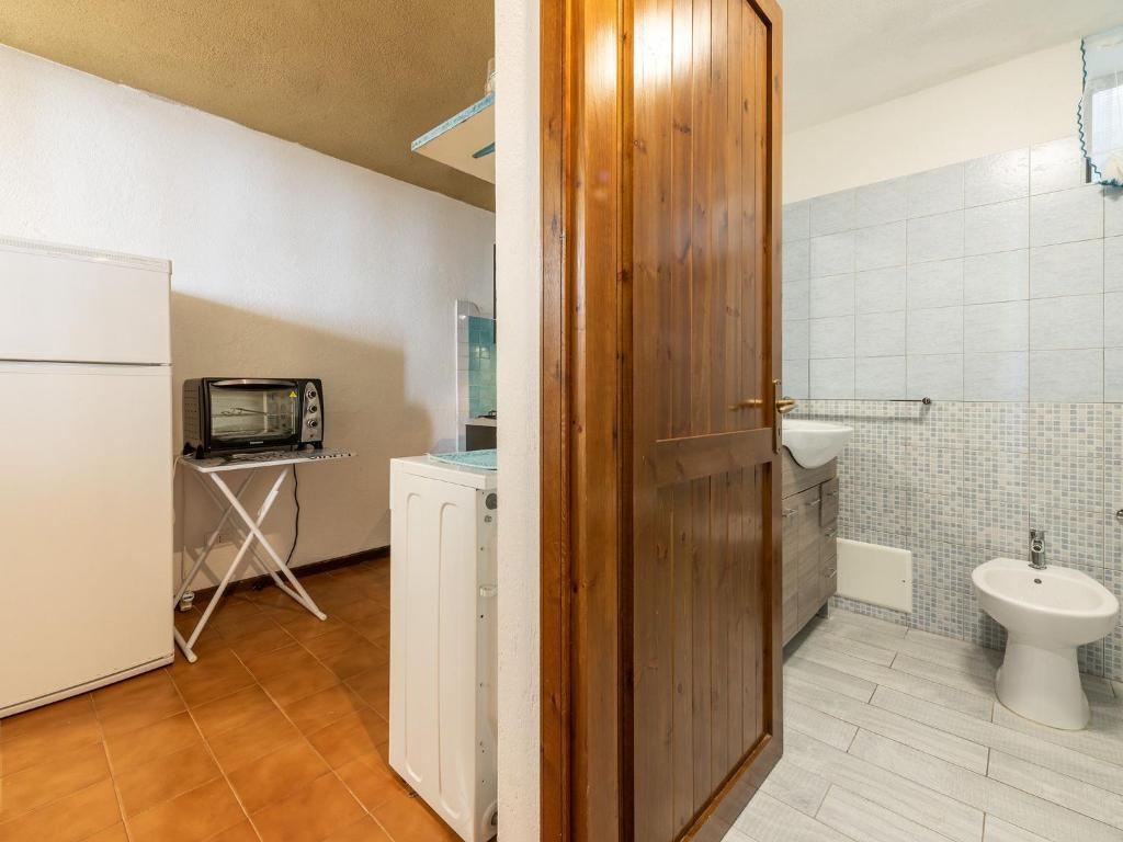 a bathroom with a toilet and a sink at VILLA CLAUDIO e LUNETTA in Villasimius
