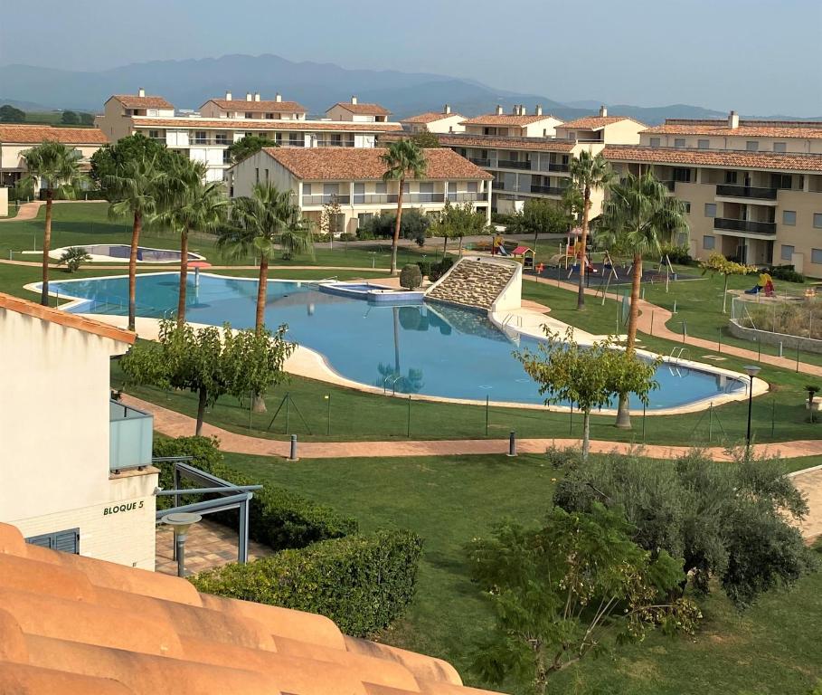 a view of a swimming pool in a resort at Apartamento Golf PANORAMICA in Sant Jordi