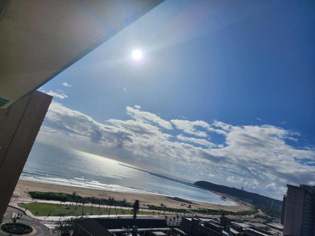 a view of a beach and the ocean from a building at 1205OnTheGoldenMile - 4 Sleeper Ocean View with Pool & Braai at 10 South in Durban