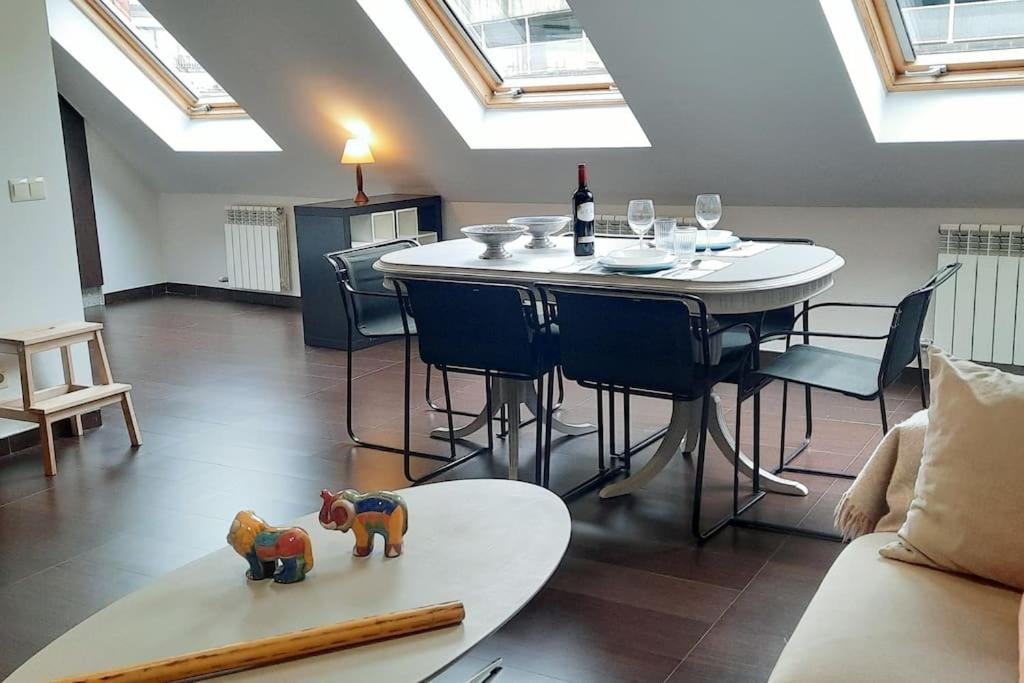 a living room with a table with two elephants on it at Luz de Vigo in Vigo