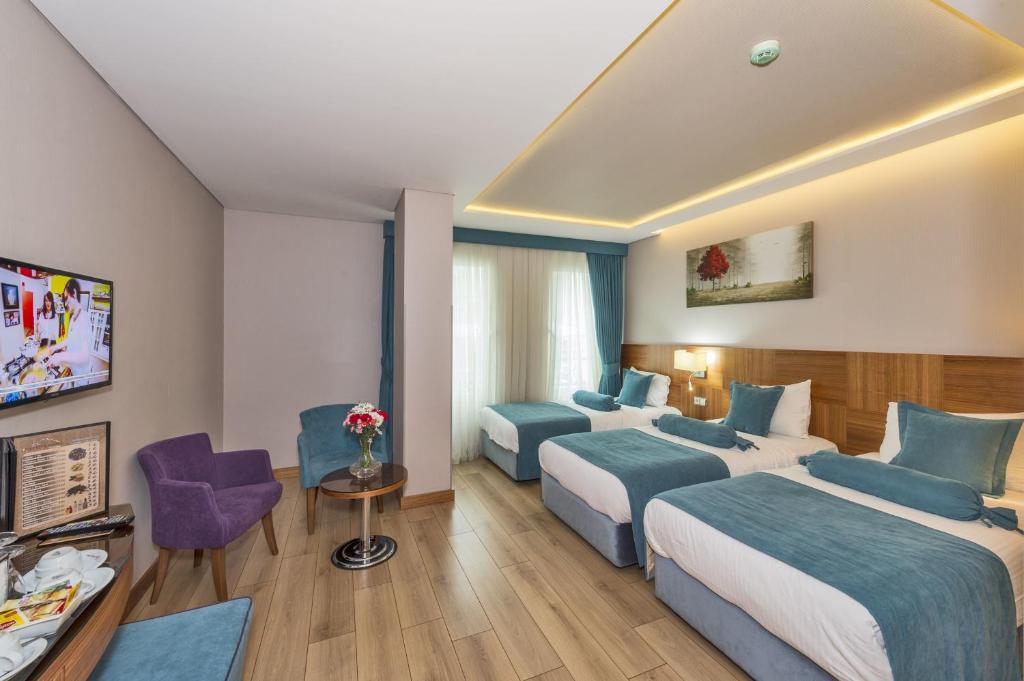 A bed or beds in a room at The Meretto Hotel Istanbul Old City