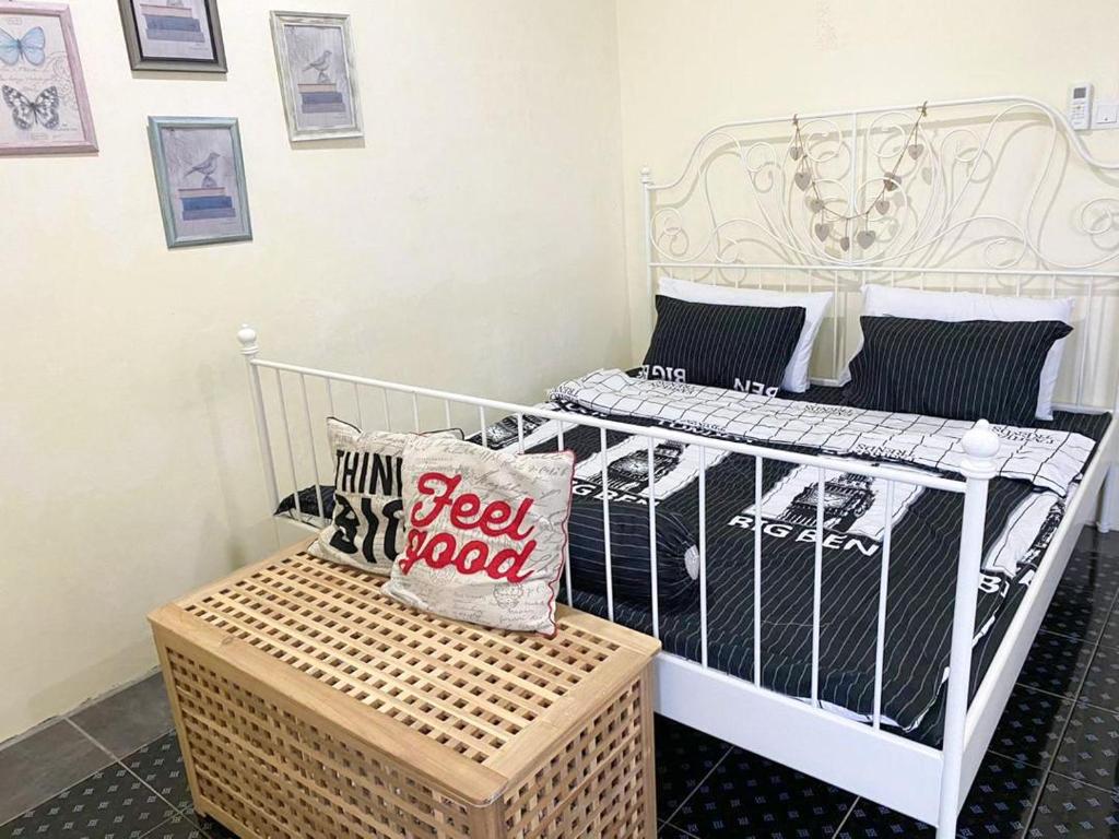 a white crib with a pillow on it at PVS Kinabalu in Tuaran