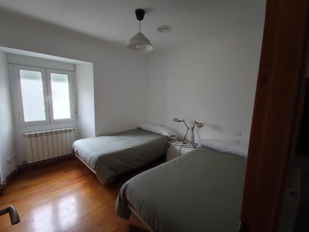 Posteľ alebo postele v izbe v ubytovaní Apartamento Sarmiento- Casco histórico Mondoñedo