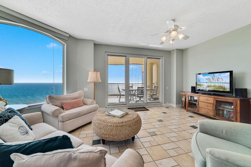 a living room with a view of the ocean at Beach Colony Tower 12B in Perdido Key