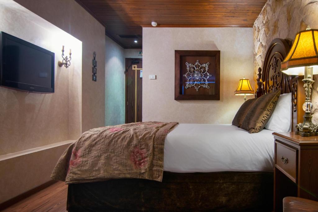 Postel nebo postele na pokoji v ubytování Hotel Kassaros