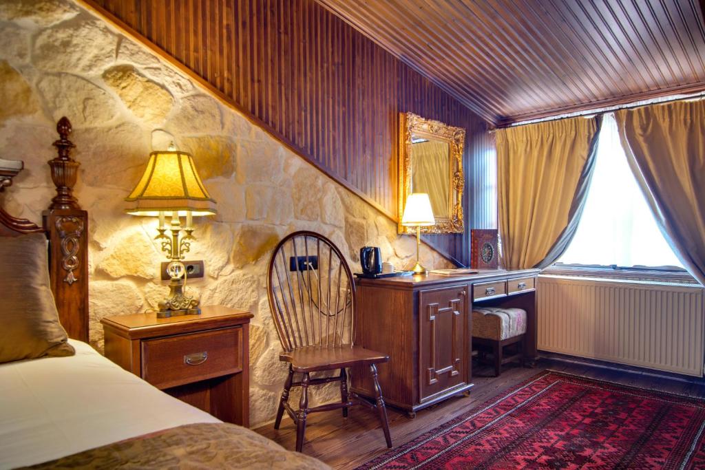 Postel nebo postele na pokoji v ubytování Hotel Kassaros