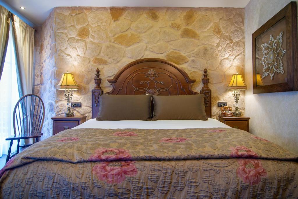 Postel nebo postele na pokoji v ubytování Hotel Kassaros