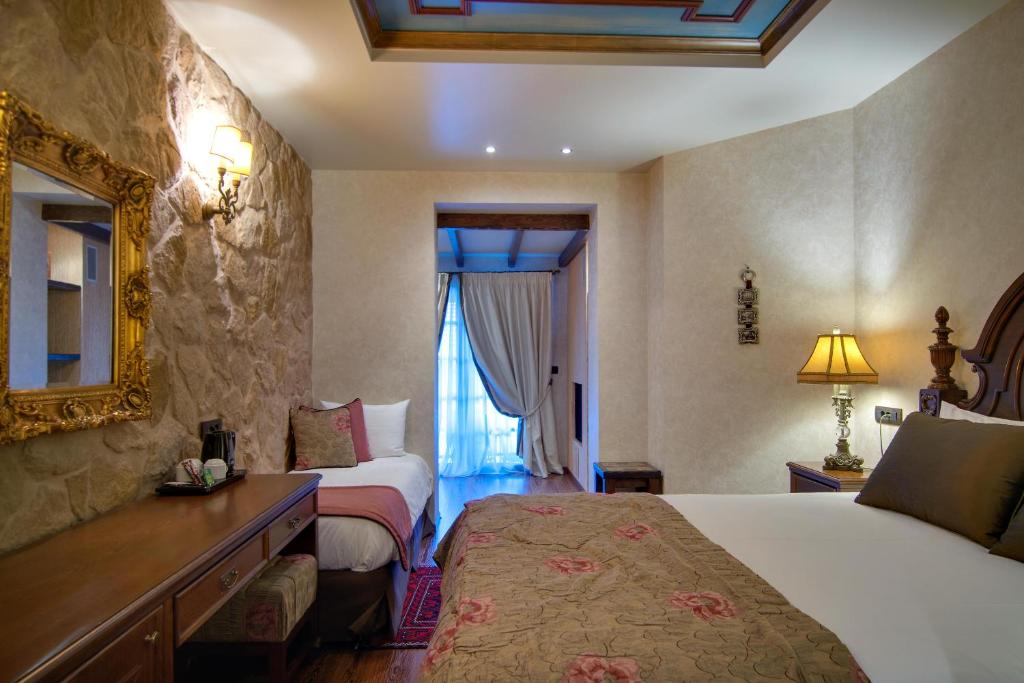 Postel nebo postele na pokoji v ubytování Hotel Kassaros