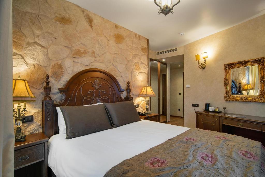 Postel nebo postele na pokoji v ubytování Hotel Kassaros