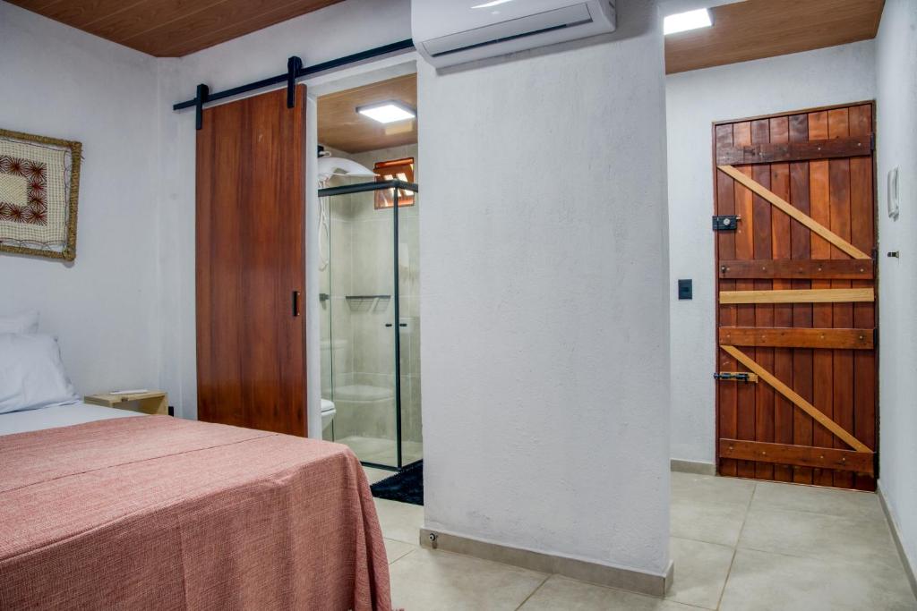 Postel nebo postele na pokoji v ubytování Ubud Apartments Praia do Frances