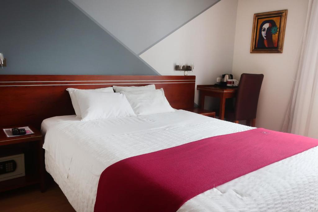 Ένα ή περισσότερα κρεβάτια σε δωμάτιο στο Hotel Boutique Runcu Miraflores