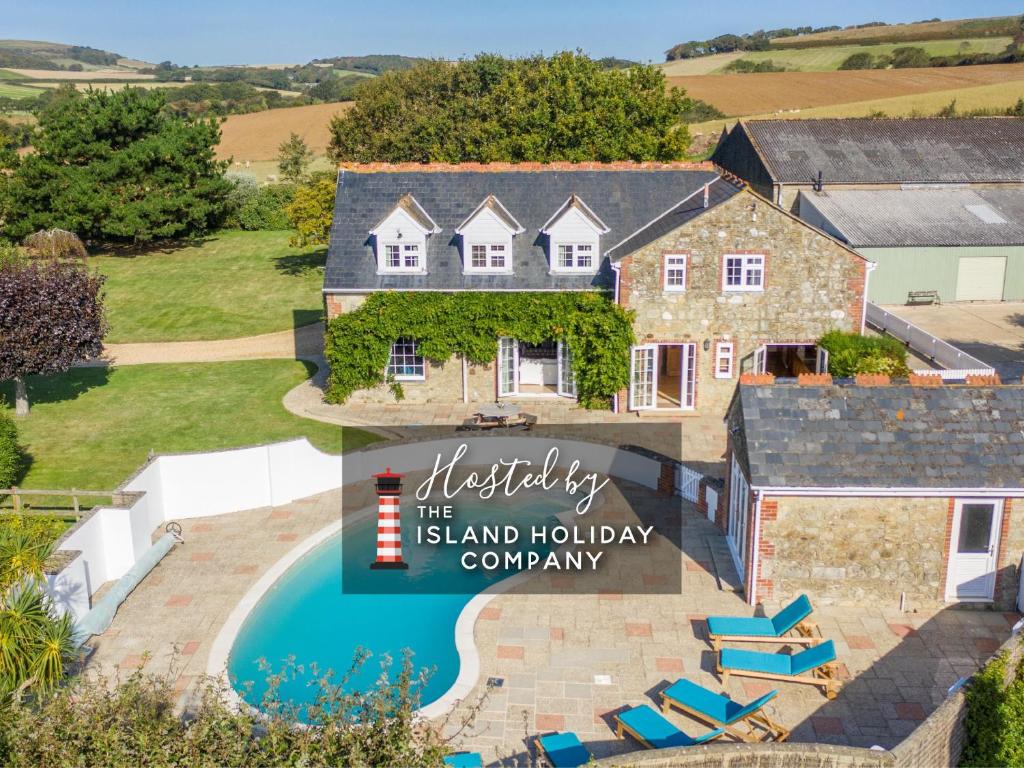 an aerial view of a home with a swimming pool at Rookley Farm Lodge - Pet friendly in Rookley