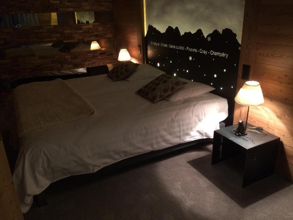 Postel nebo postele na pokoji v ubytování Le Chalet de l'Atelier - Le Nord