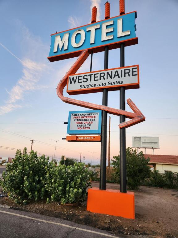 a motel sign on the side of a road at Westernaire Motel in Mesa