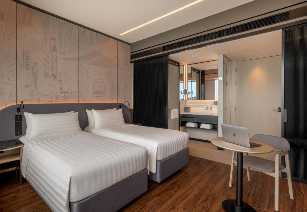 Postel nebo postele na pokoji v ubytování Jen Shenzhen Qianhai By Shangri-La