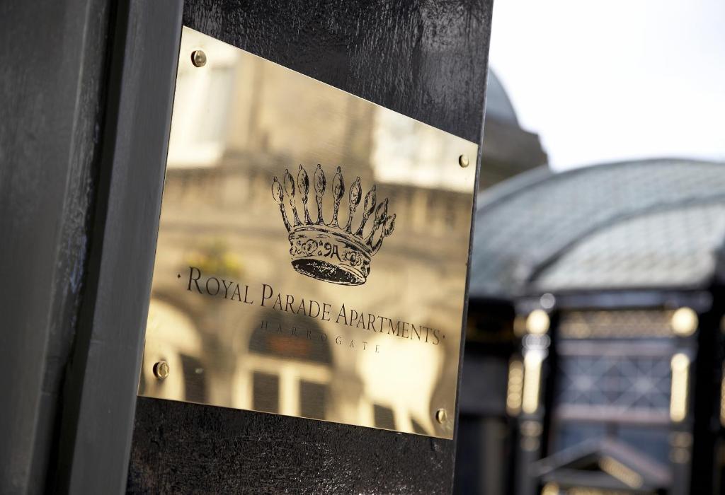 a sign with a crown on top of a building at Royal Parade Apartments in Harrogate