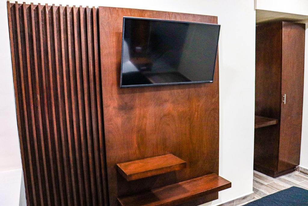 TV a/nebo společenská místnost v ubytování HOTEL MISION 11