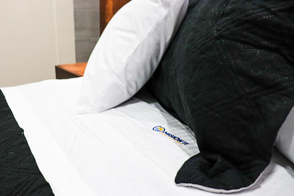 Postel nebo postele na pokoji v ubytování HOTEL MISION 11