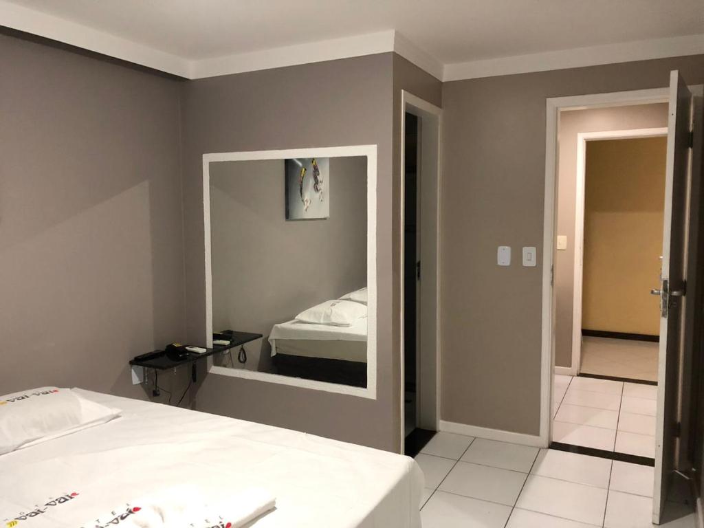 Postel nebo postele na pokoji v ubytování Iapi Hotel