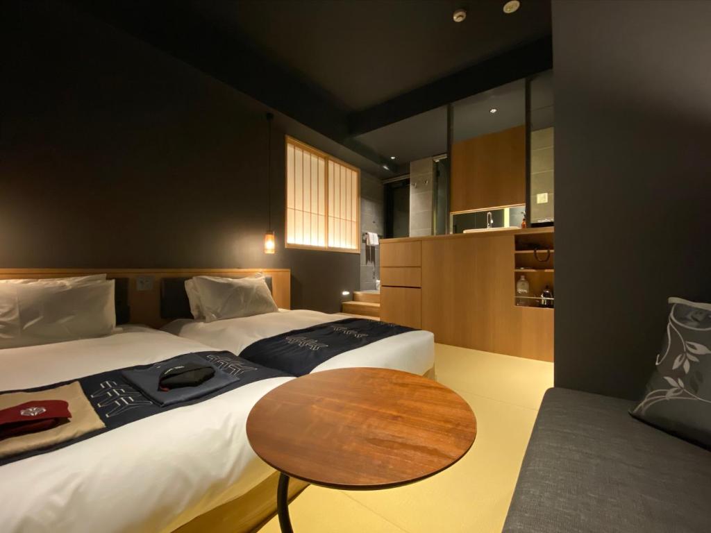 Postel nebo postele na pokoji v ubytování Hotel Zagakukan