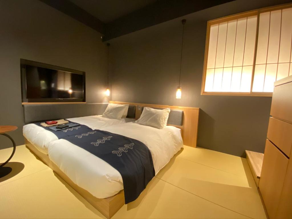 Postel nebo postele na pokoji v ubytování Hotel Zagakukan