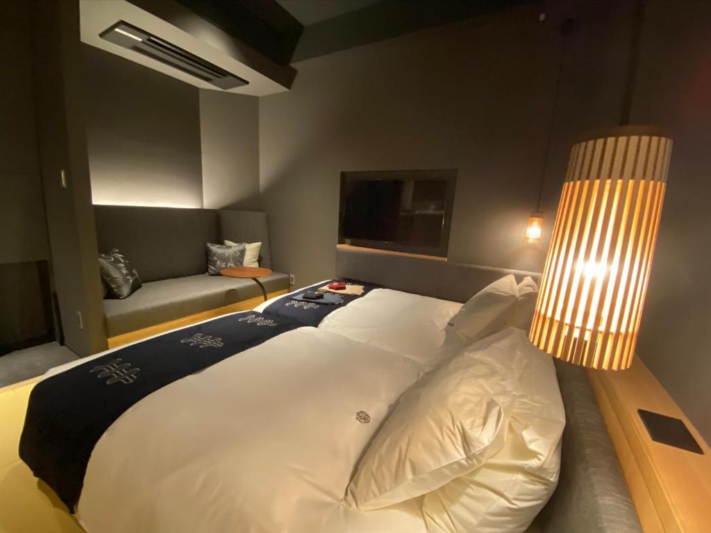 Postel nebo postele na pokoji v ubytování Hotel Zagakukan