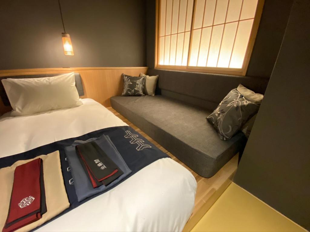Postel nebo postele na pokoji v ubytování Hotel Zagakukan