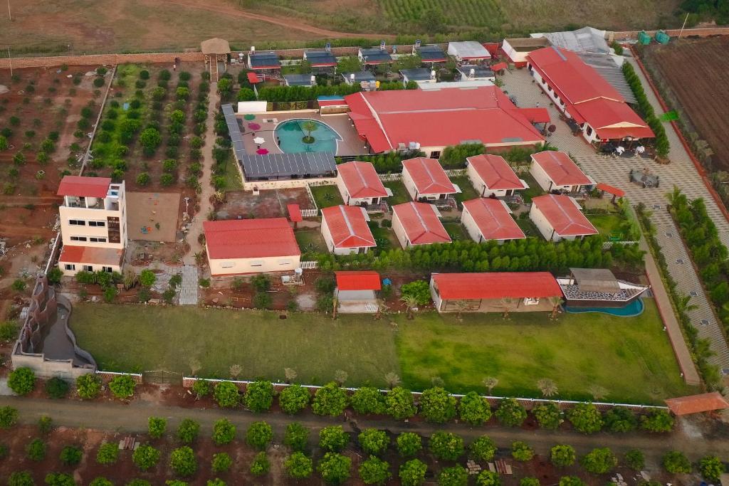 an overhead view of a model house with red roofs at Vintage Retreat Resort in Bīdar