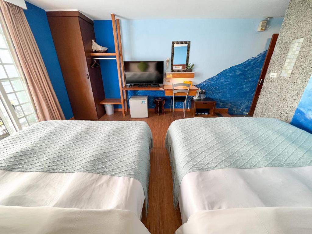 Postel nebo postele na pokoji v ubytování Tz Shin Resort Hostel