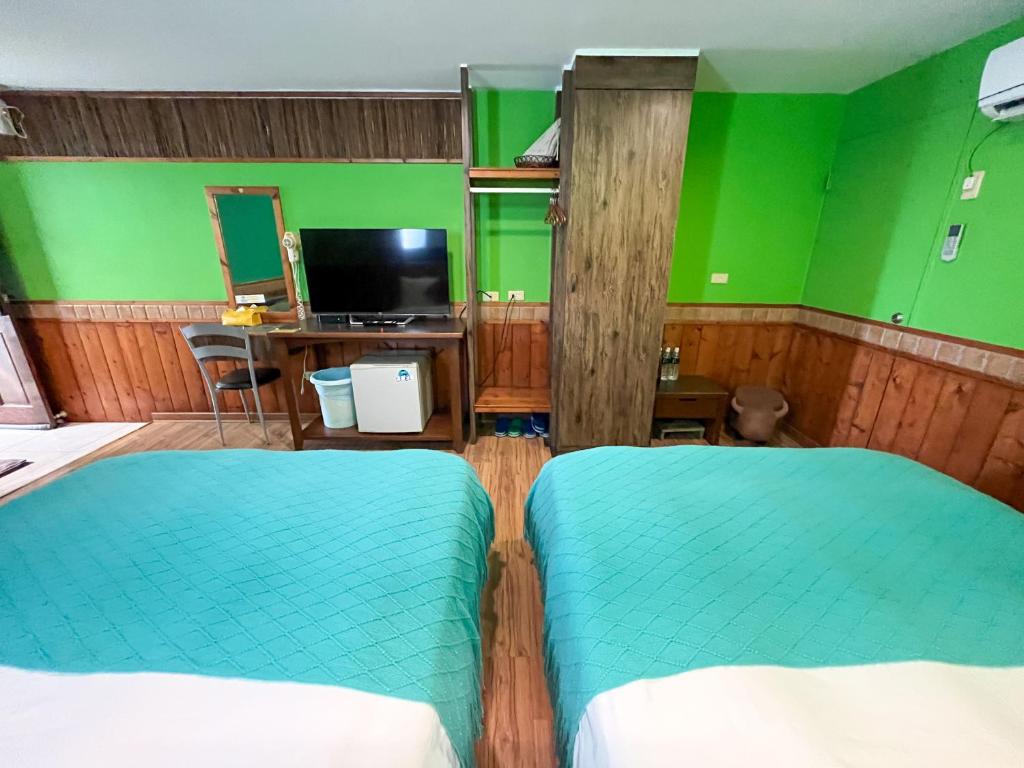 Postel nebo postele na pokoji v ubytování Tz Shin Resort Hostel