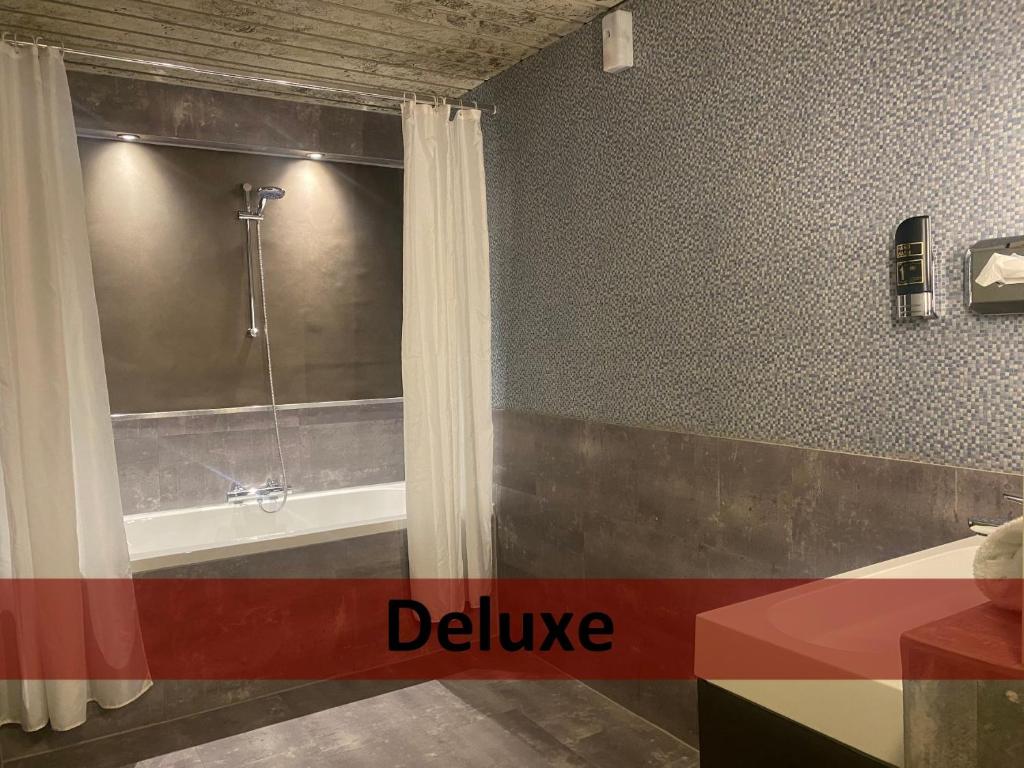 Koupelna v ubytování Grand Hotel Central