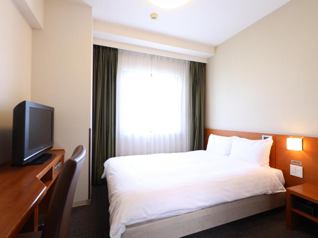 TV a/nebo společenská místnost v ubytování Dormy Inn Takasaki
