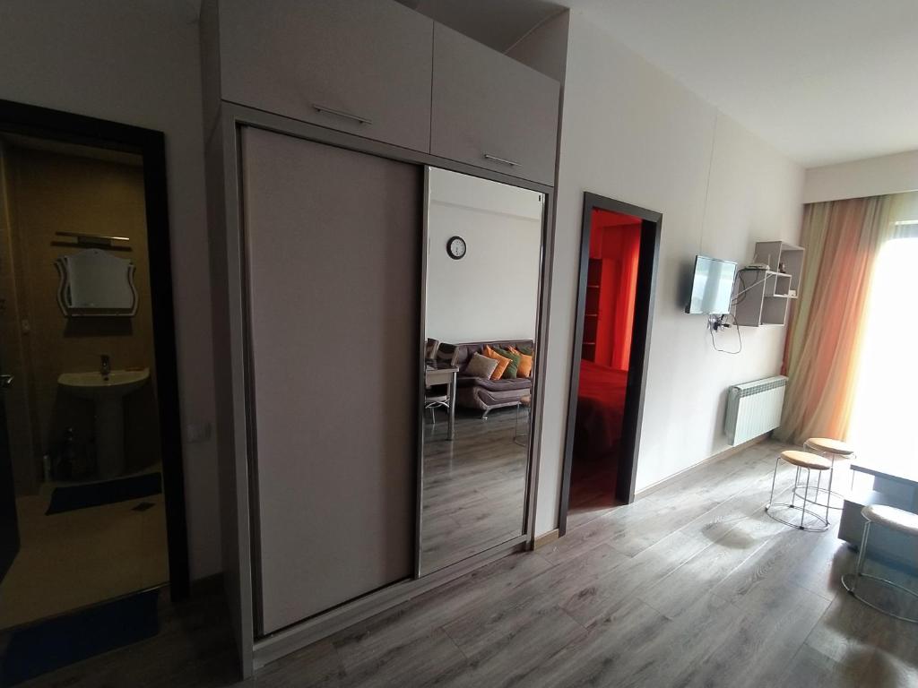 a room with a sliding glass door with a living room at Bakuriani apartament in Bakuriani