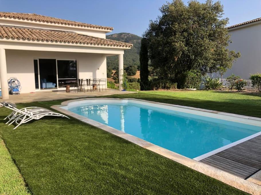 a swimming pool in the yard of a house at Villa de charme avec piscine entre Ajaccio et Porticcio in Eccica-Suarella