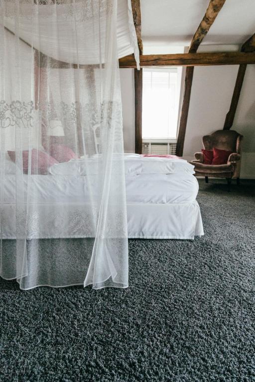 Postel nebo postele na pokoji v ubytování Altes Amtshaus, 3-Sterne Hotel Garni Superior