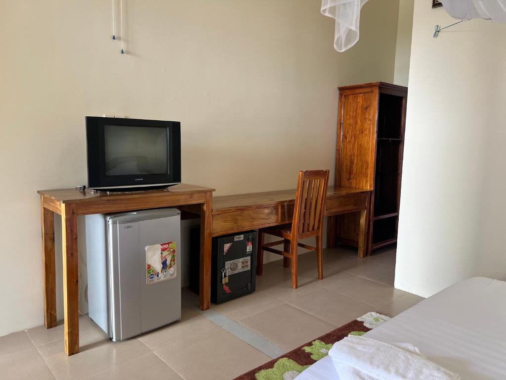 TV a/nebo společenská místnost v ubytování The Palm Tree Guesthouse