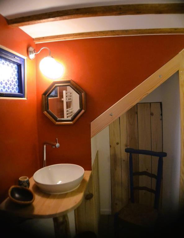 a bathroom with a sink and a mirror on the wall at Gîte &#39;An Kay Ou&#39; - Le Grand Barry in Pontaix