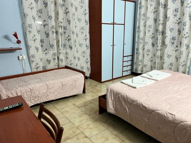 Postel nebo postele na pokoji v ubytování Albergo Fiorita