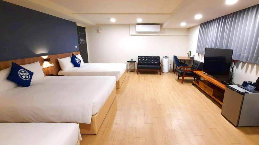 Postel nebo postele na pokoji v ubytování Holo Hotel Tainan