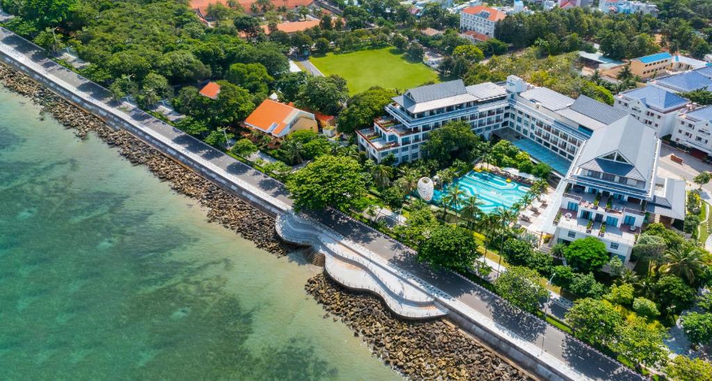 an aerial view of a resort next to the water at The Secret Con Dao in Con Dao