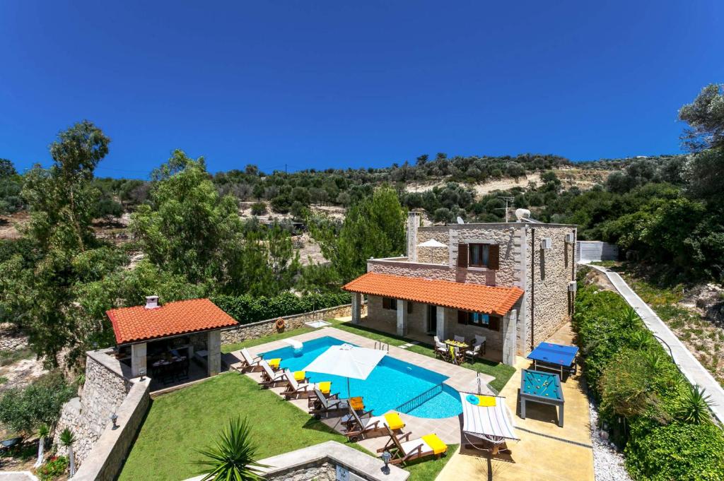 an aerial view of a house with a swimming pool at Villa Katia Faragi by Villa Plus in Giannoudi