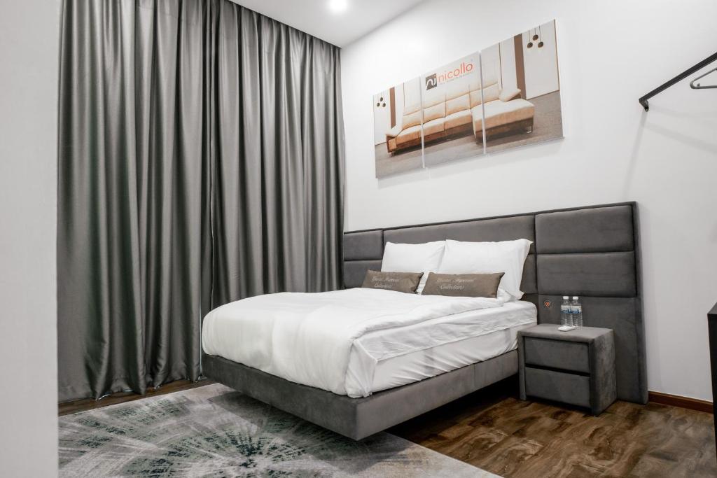 Postel nebo postele na pokoji v ubytování Norvinton Hotel
