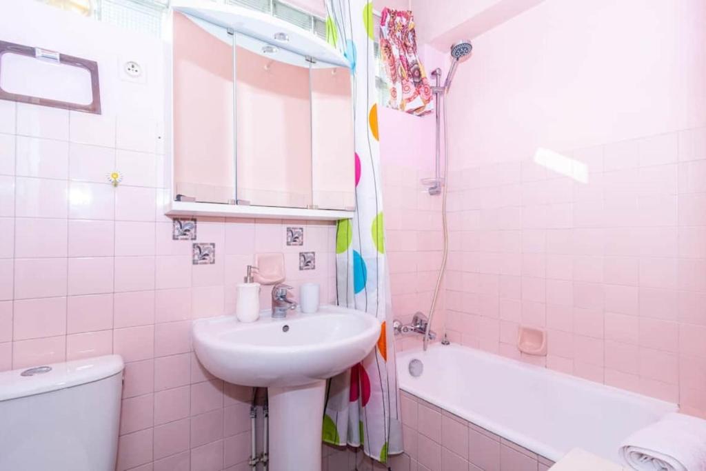 a bathroom with a sink and a toilet and a tub at Cosy Studio Cannes Center beaches shopping and congresses LIVE IN MERLE in Cannes