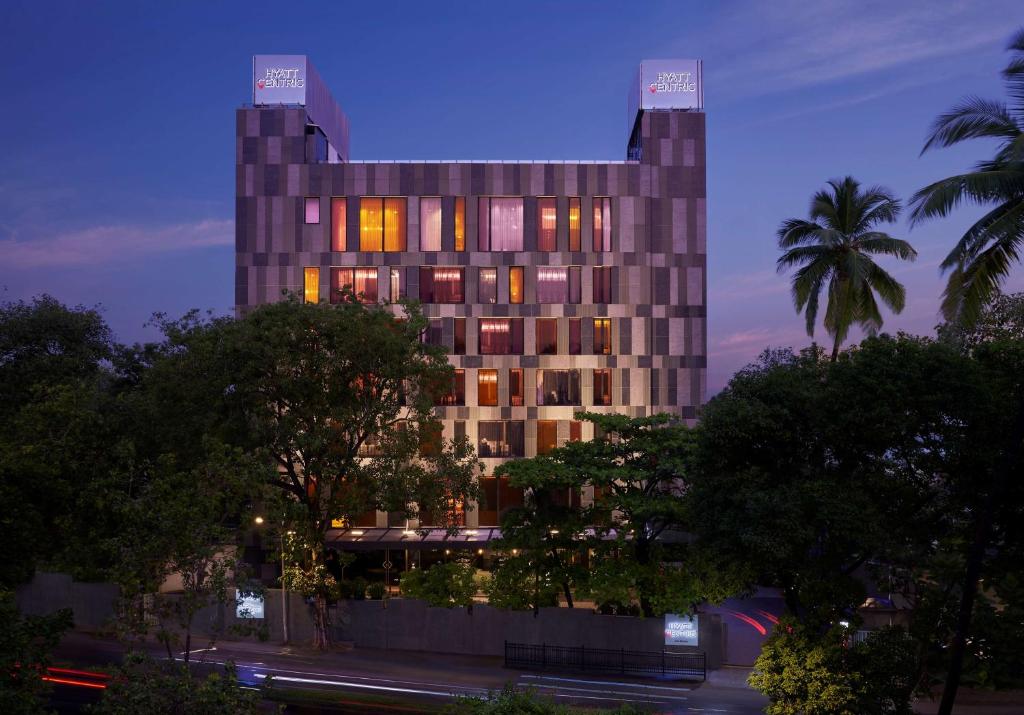 a building with a lot of windows at night at Hyatt Centric Juhu Mumbai in Mumbai